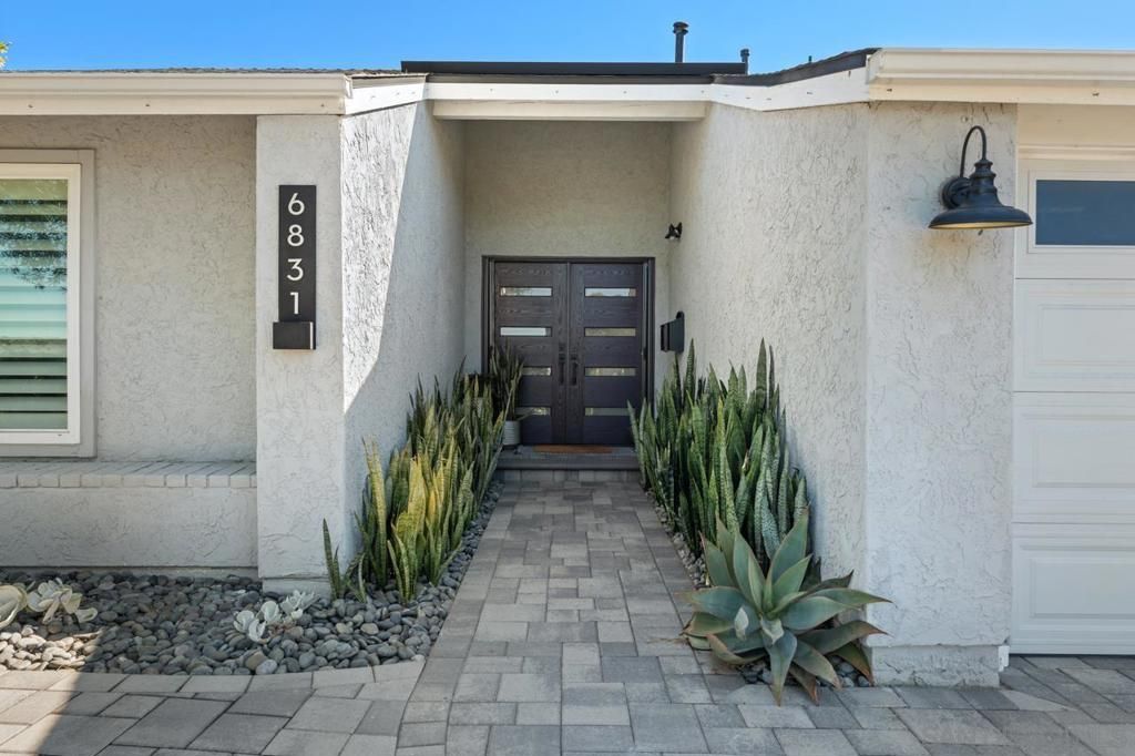 Photo of 6831 El Banquero Pl Pl, San Diego, CA 92119 (MLS # 250042183SD)