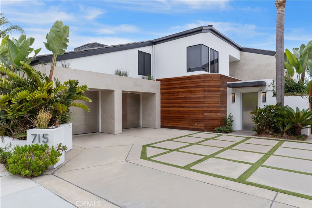 Wake up to shimmering bay views from this furnished four-bedroom contemporary coastal retreat on prestigious Bayside Drive. Perfectly situated in a serene waterfront neighborhood of Newport Beach, this home offers the best of harbor living with privacy, elegance, and direct access to the ocean.
Designed with sleek, modern lines and wrapped in warm mahogany siding, the exterior is both striking and inviting. Inside, floor-to-ceiling windows, high ceilings, and open-concept living spaces fill the home with light and create the perfect backdrop for both everyday comfort and elevated entertaining.
The heart of the home is a European-designed Snaidero kitchen featuring professional-grade stainless steel appliances, stylish finishes, and thoughtful touches throughout. Entertain effortlessly with a wet bar, media room, motorized window shades, and walls of glass that open fully to the expansive bayside patio.
Host friends in the sunken living room, gather fireside, or enjoy the seamless indoor-outdoor flow as the bay breeze fills the home. At the end of the day, retreat to your primary suite with unobstructed waterfront views, a spa-inspired bath with a freestanding jetted tub, and a luxurious steam shower.
With a smart layout offering space and separation, the upstairs includes two Jack & Jill bedrooms and a full office at one end of the home, while the fourth bedroom suite is located on the main level with a private bath — perfect for guests.
Step outside to your private dock, with direct access to Newport Harbor and the open ocean — ideal for paddleboarding, sailing, or simply enjoying the coastal lifestyle. Whether you're sipping a drink on the patio or exploring Newport’s vibrant dining and shopping scene at nearby Fashion Island, this home offers the very best of Southern California waterfront living.
Available fully furnished in September.