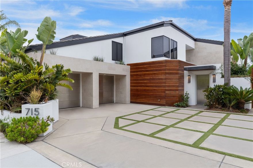 Wake up to shimmering bay views from this furnished four-bedroom contemporary coastal retreat on prestigious Bayside Drive. Perfectly situated in a serene waterfront neighborhood of Newport Beach, this home offers the best of harbor living with privacy, elegance, and direct access to the ocean.

Designed with sleek, modern lines and wrapped in warm mahogany siding, the exterior is both striking and inviting. Inside, floor-to-ceiling windows, high ceilings, and open-concept living spaces fill the home with light and create the perfect backdrop for both everyday comfort and elevated entertaining.

The heart of the home is a European-designed Snaidero kitchen featuring professional-grade stainless steel appliances, stylish finishes, and thoughtful touches throughout. Entertain effortlessly with a wet bar, media room, motorized window shades, and walls of glass that open fully to the expansive bayside patio.

Host friends in the sunken living room, gather fireside, or enjoy the seamless indoor-outdoor flow as the bay breeze fills the home. At the end of the day, retreat to your primary suite with unobstructed waterfront views, a spa-inspired bath with a freestanding jetted tub, and a luxurious steam shower.

With a smart layout offering space and separation, the upstairs includes two Jack & Jill bedrooms and a full office at one end of the home, while the fourth bedroom suite is located on the main level with a private bath — perfect for guests.

Step outside to your private dock, with direct access to Newport Harbor and the open ocean — ideal for paddleboarding, sailing, or simply enjoying the coastal lifestyle. Whether you're sipping a drink on the patio or exploring Newport’s vibrant dining and shopping scene at nearby Fashion Island, this home offers the very best of Southern California waterfront living.

Available fully furnished in September.