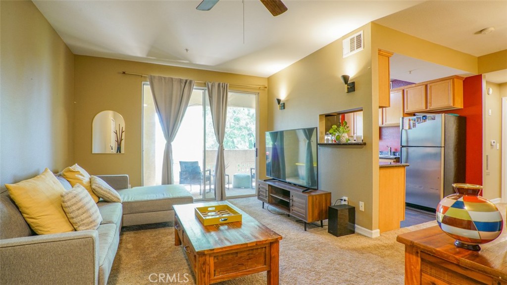 Excellent opportunity in Sonata Canyon Crest gated community! This turnkey second-floor unit features upgraded flooring, stainless steel appliances in in the kitchen, and a custom tile stand-up bathroom. The bedroom offers ample space with two closets, including a walk-in. Upgraded light fixtures throughout. Community amenities include a pool. jacuzzi, gym, sauna, tennis courts, and a clubhouse. Across from sycamore Canyon Park, close to freeways and UCR Campus. HOA fees include water and trash. Don't miss out on this gem!