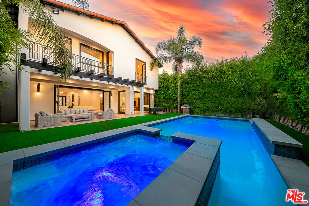 This contemporary Mediterranean stunner with top of the line finishes is located in prime Beverly Grove area near fine dining, shopping and entertainment. It features bright open floor plan, high ceilings, California style indoor-outdoor living, chef's kitchen with center island, wine cooler and top of the line built-in appliances, spacious 5 bedrooms and 5 luxurious bathrooms, huge master bedroom with high ceilings, balcony overlooking the back yard with pool and spa, walk-in closet, luxurious master bathroom with separate tub and walk-in rain shower, large patio with outdoor furniture, BBQ and entertainer's private back yard with pool and spa. 2-car direct access garage and gated driveway. Available for long term rentals and/or short term rentals with flexible lease terms.