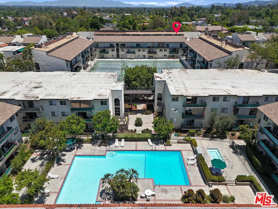 A 990 SF condo in Encino for under $300k? LOCATION, LOCATION, LOCATION! Fantastic and tranquil 2 bed 2 bath unit in one of Encino's most sought-after communities, Encino Oaks. This unit offers 2 en-suite bedrooms on opposite sides connected by an open floor plan where living room, kitchen and dining area enjoy the natural light from the east-facing balcony with tree-top views, and 2 covered parking spots steps from the unit. Community amenities include: elevator, recreation center, sparkling pool, Jacuzzi, 3 tennis courts, ping pong tables, and a cozy fireplace, BBQ areas, men's and women's separate gyms with saunas, security guard, on-site management office, and laundry rooms throughout each floor. Centrally located near the 101 & 405 Fwys near Ventura Blvd, and walking & rolling distance to Trader Joe's, Balboa Sport center, Tarzana Square, gas station, and more. Whether as income property, primary residence, or a pied-a terre in Los Angeles, this unit is move-in ready and looking for the perfect buyer!