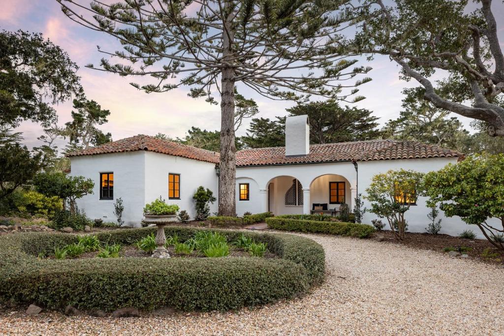 Set in one of the most iconic locations of the Del Monte Forest among the great estates of Pebble Beach, the newly and extensively renovated Miraflores is an opportunity to step back in time. This Mediterranean coastal retreat encapsulates the classic 1920s Pebble Beach essence. The main residence, set on an expansive 2.38 acre lot, offers beautiful views of the ocean, cypress forest, and 17-Mile Drive. Every detail of this home has been thoughtfully curated, blending classic elegance with modern sophistication. The grand rooms with soaring ceilings and large windows allow for abundant natural light throughout the home's 4,770 SqFt of living space. The living room with fireplace flows seamlessly into the dining area, both of which are designed to highlight the ocean vistas. The gourmet kitchen features state-of-the-art appliances and custom cabinetry. Charming stone patios are the perfect venue for intimate gatherings and grand celebrations. Not to be missed is the separate 1-bedroom private casita with a comfortable living room, kitchen area, fireplace, and full bathroom. All this just steps from Pescadero Point, the old ghost and witch tree landmarks, Miraflores offers timeless elegance, natural beauty, and exceptional privacy, just moments away from the Pebble Beach Lodge.