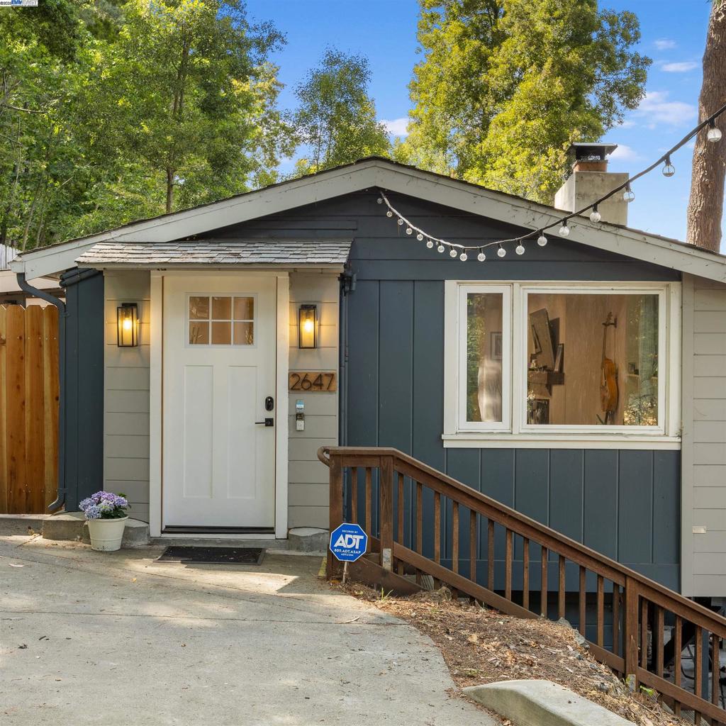 This beautifully updated Oakmore residence seamlessly blends modern living with timeless character. Thoughtfully reimagined, the home features three bedrooms and three full baths, including a recently remodeled half bath transformed into a full bathroom. A versatile space on the lower level also offers potential for an in-law suite, adding even more flexibility to the floorplan. The efficient layout creates a natural flow between rooms while preserving a sense of individual charm. Enjoy the inviting warmth of the living room fireplace, take in expansive views through the dining room's large windows, or step through sliding doors to a low-maintenance outdoor living area—perfect for relaxing or entertaining. The sunlit kitchen marries vintage charm with modern finishes, featuring marble countertops, a classic subway tile backsplash, and distinctive checkerboard flooring—sure to inspire your inner chef. The main level hosts the serene primary suite with a generous walk-in closet and a spa-inspired en-suite bath, complete with double sinks and a striking herringbone tile accent wall. A second bedroom, full bath, and cozy study complete this level. Downstairs, you'll find a spacious future in-law or ADU accommodations.
