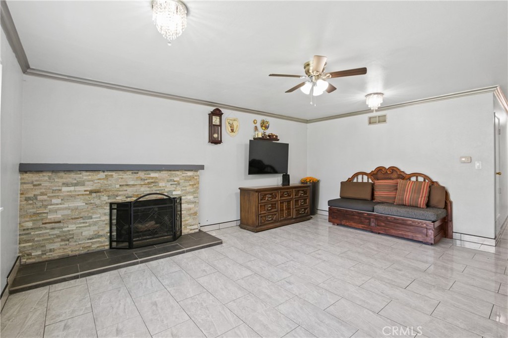 Welcome home to this charming single-level townhome, featuring 2 spacious bedrooms and 2 full bathrooms in a thoughtfully designed, move-in ready layout. NO ONE ABOVE OR BELOW YOU. CORNER UNIT, FACING GREENBELT. Enjoy the cozy fireplace in the living room, and an upgraded kitchen, bathrooms, and the flooring throughout the home. Step through the sliding glass doors from the dining area to your private front patio - perfect for relaxing or entertaining, offering extra privacy. Additional features include in-unit laundry, ceiling fans, window A/C units in every room, and central heating for year-round comfort. The generous attic space provides ample storage, while the HOA covers TRASH and HOT WATER. Community amenities include two pools, a playground, and a BBQ area. Parking includes 1 assigned space (#264) and 1 permit parking spot. Prime Anaheim Location: Walking distance to grocery stores, schools, and public transportation, 15 minutes to Disneyland & Resort, 10 minutes to Knott’s Berry Farm, Close to Fullerton College, Chapman University, UC Irvine, and Western State College of Law, Just 7 miles from the beach, Convenient access to major freeways: 5, 91, 22, and 605, Near Angel Stadium, dining, shopping, and endless entertainment options. Don’t miss this opportunity to own a turnkey townhome in one of Anaheim’s most convenient and connected neighborhoods!
