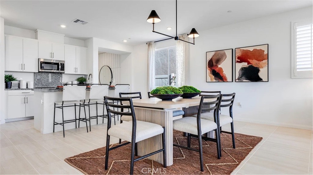 NEW CONSTRUCTION! This single-level home features a modern and low-maintenance design. Two secondary bedrooms share a private hallway off the entry, leading to a spacious and flexible open-concept floorplan with convenient access to a covered patio for seamless entertaining and multitasking. The luxe owner’s suite is tucked away into a private rear corner, complete with a spa-inspired bathroom and walk-in closet.
The kitchen features new caledonia granite countertops and white cabinetry.
Ara is a new collection of brand-new single-family homes for sale at the Skyborne masterplan to Desert Hot Springs, CA. The community features fantastic onsite amenities with the added benefit of a low-HOA, perfect for first-time homebuyers. Golf Cart Tours are available to view the new homes and the Skyborne amenities. Nearby cities offer plenty of options for shopping, dining and entertainment, with trendy Palm Springs being just 10 minutes away. Nature lovers will love being just an hour’s drive from the world-famous Joshua Tree National Park.