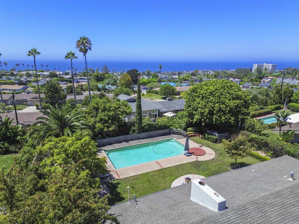 Amazing opportunity to experience coastal living in this lovely 3-bedroom, 2-bath single-level residence, ideally situated in the desirable Muirlands neighborhood of La Jolla. Step inside to discover an inviting family room featuring a cozy fireplace, seamlessly opening to a spacious backyard complete with a sparkling pool and lush views—perfect for entertaining or unwinding. The kitchen is a chef's delight, offering a central island, refrigerator, microwave, ample storage, and a convenient eat-at bar. This home includes a versatile bonus room, ideal for a home office, workout area, or additional living space. The property greets you with a private front yard and a convenient circular driveway. Families will appreciate the proximity to top-rated schools, while being close to downtown La Jolla provides easy access to shopping, dining, and cultural attractions. Don’t miss this rare opportunity to lease this beautiful home in one of Southern California’s most sought-after communities.