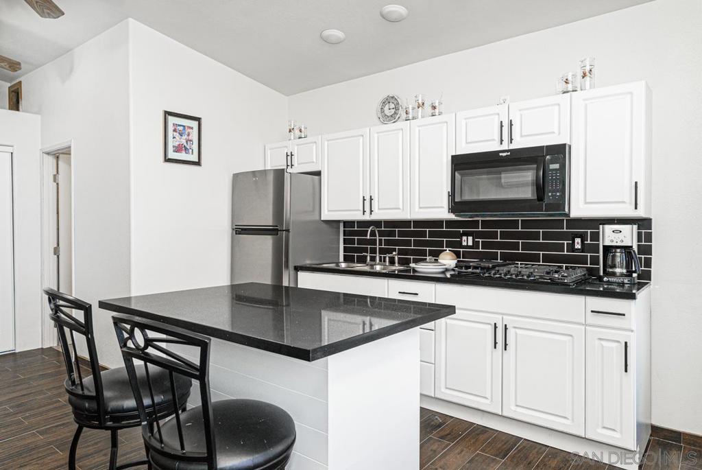This studio is a furnished ADU Conveniently located in San Diego. Newly built and fully equipped with a large full bathroom, the kitchen is brand new, remodeled with new countertops, cabinets, and stainless steel appliances. New A/C, and tankless water heater. Large kitchen with island and barstools, private side patio with a small front porch. Available for rent short-term and long-term rental. Amenities include a gas stove, stainless steel refrigerator, microwave, toaster oven, storage space, and private side yard. This home is centrally located in San Diego near the 94, 54 & 125 freeways. Utilities: water, gas, electricity, and internet are included in the price of rent. UNIT AMENITIES Air conditioner, Climate control, Controlled access, Furnished, Kitchen island, Microwave, Mirrors, Pet friendly, Private patio, Stove and oven, Tile floors, Vaulted ceiling, Window coverings