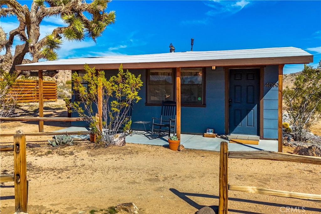 Welcome to The Moon Cabin — an Apartment Therapy featured desert retreat with over 450 five-star reviews as a short-term rental, standout design and proven rental appeal.
Set on nearly two flat acres at the base of Bunker Mountain, this 1959 Jack Rabbit Homesteader blends mid-century charm with thoughtful modern upgrades. Located just 10 minutes from the entrance to Joshua Tree National Park and close to local dining, shops, and art spaces, it’s perfectly positioned to enjoy the best of the high desert.
Inside, the one-bedroom, one-bath home features custom details throughout: hand-built raw edge shelving, sliding barn doors, designer lighting, and a freestanding mid-century wood-burning fireplace that anchors the open living area. The kitchen is both stylish and functional, with quartz countertops, floating shelves, and seamless flow into the main living space.
The nearly two-acre lot offers privacy, natural beauty, and room to expand. Native flora, boulder formations, and unobstructed views create a stunning backdrop for outdoor living. A bocce court adds a fun and unique touch for guests or gatherings.
The Moon Cabin has a strong track record and future potential—whether you're looking for a personal escape, a creative live/work home, or a part-time rental property with character and income potential.