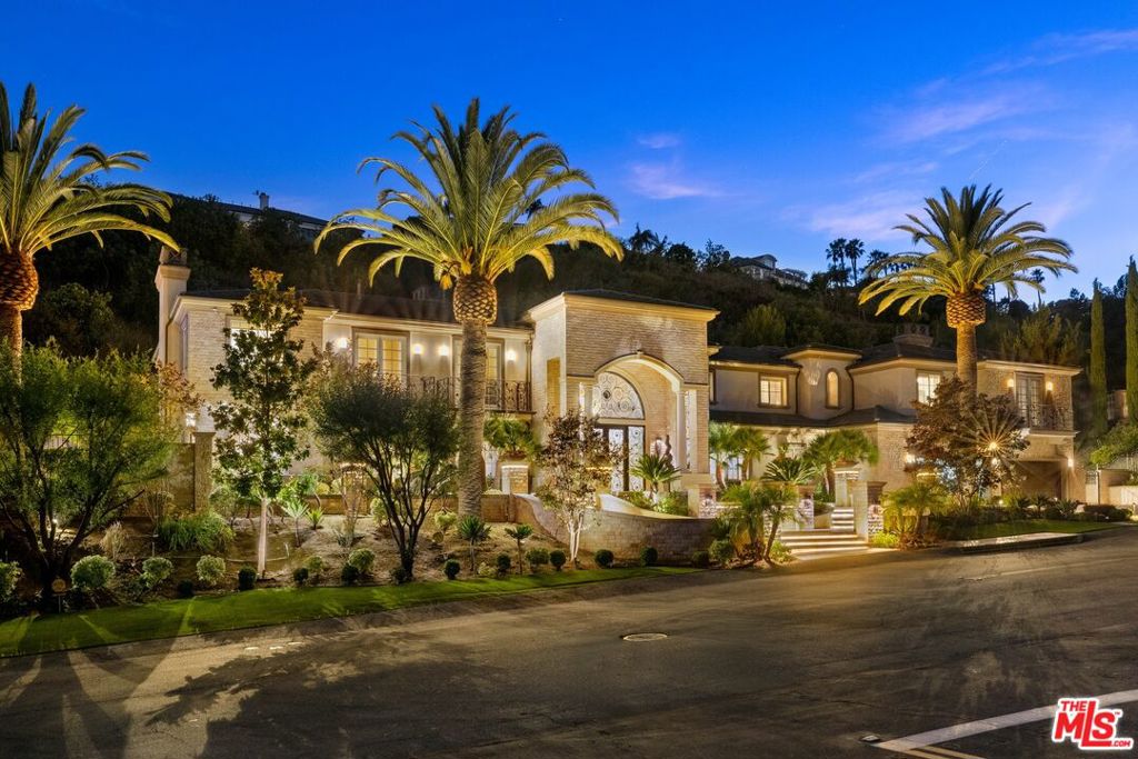 Absolutely no expense spared in this sprawling custom estate set behind the guard gates of The Country, a high security community offering the utmost privacy for the most discerning Buyer. With six bedrooms including dual primary suites, seven bathrooms, and boasting a strikingly authentic traditional Japanese dining room, custom wood paneled study, billiards/game room, and at just over 10,000 square feet, this home is the ideal family compound or entertainer's retreat. Truly the epitome of indoor/outdoor living, with walls of glass opening to a magnificent rear yard with features including a putting green, outdoor stage, charming koi pond, infinity edge pool and spa with sunken loungers, and a detached pool house with a dry and wet sauna. Set in one of the premier gated communities of Southern California, this estate melds expert modern craftsmanship with Mediterranean flare.