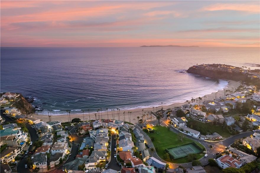 An extraordinary prospect of owning a front-row offering in the highly regarded community of Emerald Bay. Meticulously maintained for decades by the current owners, the property now presents a prime remodel or rebuild opportunity for those seeking to reside in Laguna Beach. The immediate proximity to the Pacific Ocean ensures that all living spaces are filled with the sound of waves and coastal breezes, creating a serene atmosphere throughout. The main level features elegant water-facing gathering spaces, including a formal sitting room with a fireplace and sliding doors to the oversized wraparound patio. The central dining area connects to the property’s kitchen with access to the home’s backyard. Elevated and secluded, it abounds in lush greenery. On the upper level, the principal suite features sit-down ocean views, a dressing area, and an ensuite bath. Offering privacy as well as a sense of community, Emerald Bay is sought out for its unparalleled amenities. The highlights of this guard-gated enclave include a residents-only beach, green sections, sports courts, a lap pool, and a neighborhood atmosphere - all in an accessible North Laguna Beach location.