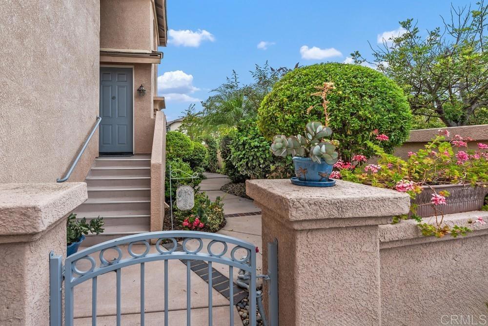 Experience stunning sunset views from this spacious Bernardo Ridge home, boasting meticulously kept landscaping with vibrant plants and succulents. Beautiful park across the street. This bright, reverse floor plan maximizes the vistas, featuring an upstairs primary suite with vaulted ceilings and a generous kitchen flowing into a living and dining area with a cozy fireplace. Step onto the newer trex floored balcony directly from the living room to relax and soak in the western views and the beautifully manicured, fully fenced backyard. Downstairs, you'll find a versatile bonus room (perfect for a 4th bedroom, office, or playroom), two additional bedrooms with direct backyard access, a full bath, and a convenient laundry closet. The primary suite offers a luxurious retreat with vaulted ceilings, a ceiling fan, dual vanities, a tiled walk-in shower, and an organized walk-in closet. The HVAC system, washer/dryer is newer and fridge is brand new. Beyond your private oasis, discover the amenities of Vista del Lago, including two heated pools (one a lap pool!), two spas, four lighted tennis courts, an exercise room, and a banquet room. Located close to Lake Hodges, there are plenty of biking/hiking trails and a few minute drive to Westfield's shopping center. This home is located in the acclaimed Poway Unified School District with the designated schools: Chaparral Elementary, Bernardo Heights Middle School and Rancho Bernardo High School. 24 hour gate guarded community. Washer/dryer and refrigerator included. EV CHARGING STATION NEARBY IN DEVELOPMENT.