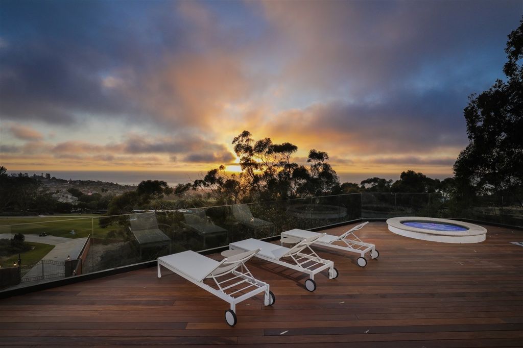 Over 7000 SF of contemporary elegance. Newly designed and constructed to capture spectacular ocean views throughout. Sophisticated, sleek design with soaring ceilings and open flexible spaces. Award-winning Builder, Armando Flores of CHARCO Design & Build has extensively used modern industrial, luxury finishes and materials. Seamless integration of indoors to outdoors living. Entertaining and relaxing is the theme of this home. Throw in a golf course view after a round of golf and you have it all. Neighborhoods: Country Club View: City,Panoramic Ocean Sewer: Sewer Connected