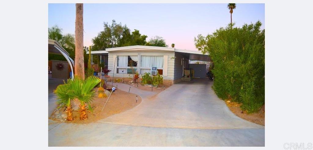 Ideal as a second home!!! Drive through Ramona, Julian, and then you’re suddenly here in desert paradise! Boho style manufactured sanctuary in resort park that includes amenities such as golf. 55+ plus community! Airbnb and roommates are permitted, buyer to confirm details with the HOA. Carport can fit two cars, if they park back to back. Space rent is $960. Schedule all showings with Listing Agent: Realtor Britta (760) 566-2773.