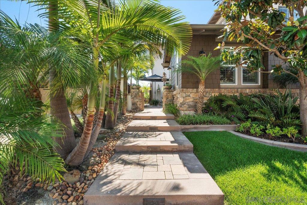 Welcome to 3737 Bergen Peak Pl, located in the highly desirable Foothills community of Carlsbad, also known as Robertson Ranch East. This rare Plan 3 “Sycamore” model by DR Horton offers 3,150 sq ft of flexible living space, featuring 5 bedrooms, 4.5 bathrooms and a large upstairs bonus/family room. One of only three homes with this unique layout in the entire community. 3 Car garage with plenty of storage. Interior features include hardwood floors, crown molding, custom built-ins, a cozy fireplace, and a chef’s kitchen that opens to spacious living and dining areas. Recently updated for modern living. Energy-efficient upgrades include owned solar, tankless water heater, built-in EV charger, whole-house vacuum, and water softener. The freshly painted exterior and spacious backyard are ideal for entertaining. Enjoy resort style amenities such as Olympic-size pool, cabanas, children's pool, spa, pickleball courts, five parks, private community events, walking trails, yoga circle, and more. Located minutes from top rated Carlsbad schools, golf courses, shopping, dining, and beaches. A rare opportunity to own a move-in ready, solar-powered home in one of North County’s most sought out neighborhoods.