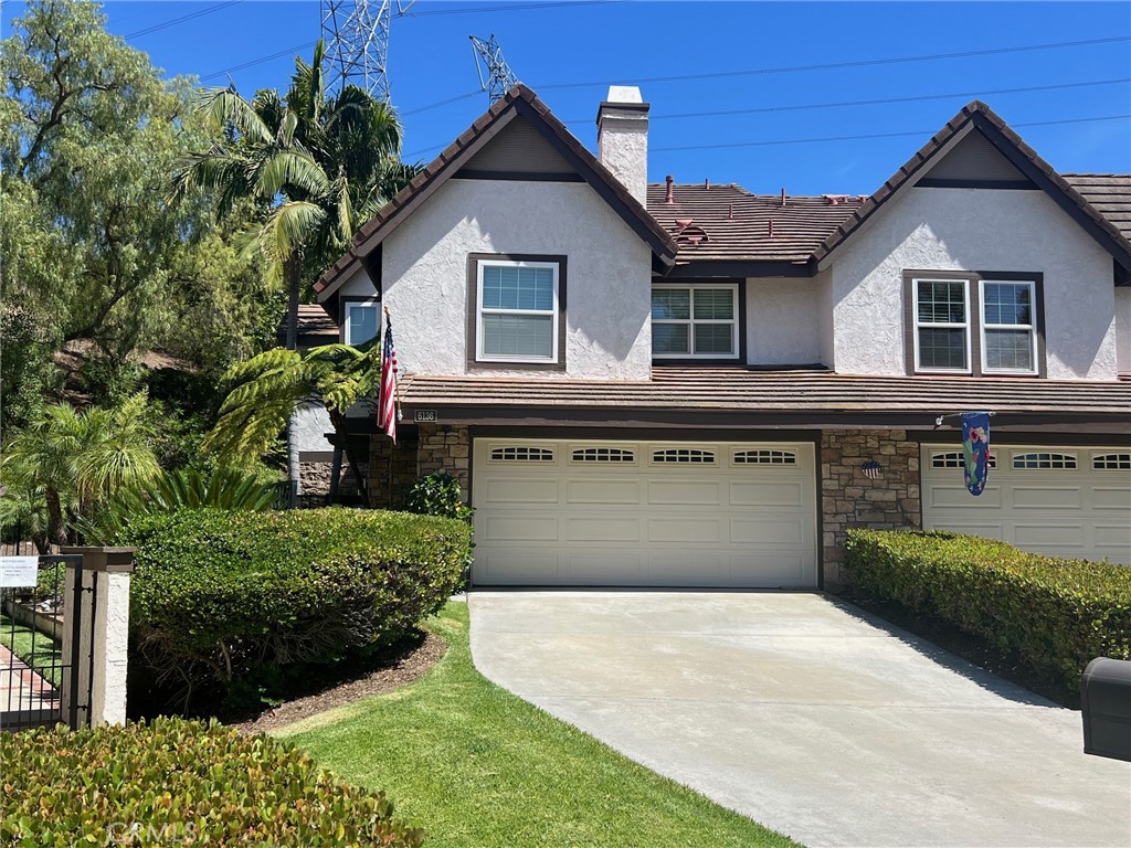 Discover Your Private Oasis in Anaheim Hills. Truly a ONE OF A KIND!
Welcome to this exceptional townhome—one of only two in Royal Circle Village with a true backyard retreat. Nestled against a lush wildlife hillside, this home offers complete privacy and a serene setting perfect for nature lovers and outdoor entertaining. The beautiful green lawn is perfect for pets. * Step into your own palapa-covered patio, featuring a cozy gas fire pit made for year-round enjoyment. * Inside, the recently remodeled kitchen blends style and function with a charming bistro dining area, plus a separate formal dining room ideal for hosting. * The open living room with vaulted ceilings, is anchored by a newly remodeled bar area, including new cabinets and wine bar, and a gorgeous fireplace with a custom live-edge mantle. It opens directly to the private backyard through a large slider—bringing the outside in. * Beyond the yard is another large grassy area, but only accessible by two units - yours and your neighbor's. There is a wrought iron gate that leads to the private second yard and nature area.
* The downstairs bedroom also has its own slider to the patio. A full bath completes the main level.
* Upstairs, the loft with built-ins provides flexible space, joined by two primary suites. * The main suite is expansive, featuring vaulted ceilings, a sitting area, fireplace, additional lighted closet space, and two en-suite baths—one with a glamorous sit-down vanity and both sharing a luxurious, light-filled shower. A pull-down ladder in the hallway accesses substantial attic storage. * The second primary suite also boasts a beautifully remodeled, enlarged bathroom and lighted closets. * There is ample storage and closet space in this home.
* The attached garage is outfitted with built-in cabinets, a hanging rack, and durable granite-look flooring. * Fresh WinDor windows and sliders top off the numerous enhancements. * Air conditioning unit is 8 years new. Water heater is 2 years new. * PARKING: This home can accommodate FIVE cars; two in the attached garage, two in the long driveway, and one assigned space #16! • Conveniently close to Anaheim Hills Golf Course, Weir Canyon Regional Park, schools, shopping, restaurants, and major freeways
* Truly a must-see—there’s simply nothing else like it!