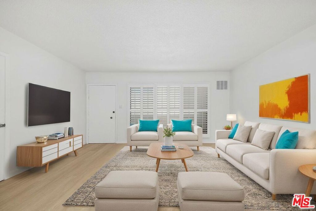 Welcome to your beautifully remodeled Santa Monica retreat! This 1 bed, 1 bath condo features Positano oak vinyl floors, Calacatta Cloud countertops, brand new stainless steel appliances, an oversized kitchen sink, and modern shaker-style cabinetry throughout. The bathroom has been fully renovated with clean, contemporary finishes. The open layout connects the living, dining, and kitchen areas, and a rare floorplan with virtually no shared walls offers enhanced privacy. The bright bedroom includes multiple closets and French doors that open to a Juliet balcony. Additional storage includes a hall closet and an oversized closet in the living area. A private patio is ideal for a cafe table, plants, or light outdoor exercise. Located on a quiet, tree-lined stretch of Centinela in a gated building with a pool, community laundry, and covered parking with storage, this move-in-ready condo is a standout Santa Monica opportunity with low HOA dues. Virtual Staging in some photos.