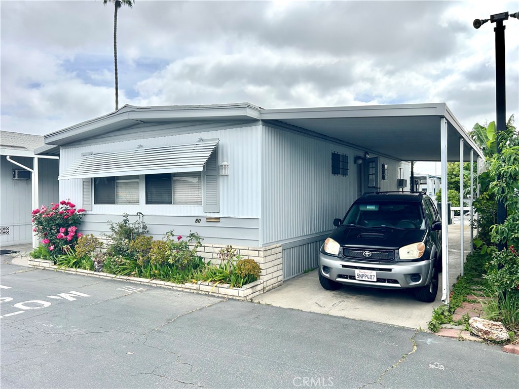Pull into Town & Country Villas, and unit is to the right of the swimming pool & all the great guest parking! Carport too! Registered Owner 55+ and other occupants 40+. Low Land Lease $1,100. Park is directly across from the Tue Quan Meditation Center; Close to Our Lady of La Vang Church & Bo De Temple. Amenities include spacious clubhouse for special and important events, and did we mention swimming pool and guest parking right in front of unit? Speaking of pool, clubhouse has billiards! Walk right to the corner to the Pacific Market & the Cozy Corner Cafe. All buyers will have to qualify with park management for approval. Did we mention the low land lease of $1100?