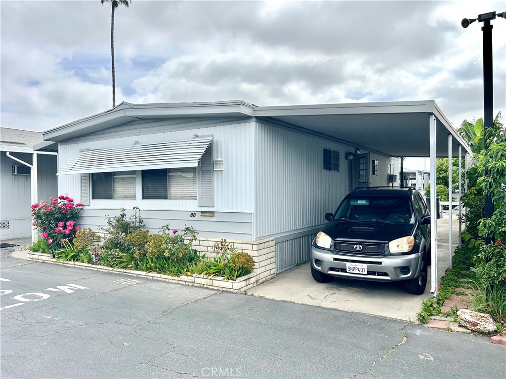 Pull into Town & Country Villas, and unit is to the right of the swimming pool & all the great guest parking! Carport too! Registered Owner 55+ and other occupants 40+. Low Land Lease $1,100. Park is directly across from the Tue Quan Meditation Center; Close to Our Lady of La Vang Church & Bo De Temple. Amenities include spacious clubhouse for special and important events, and did we mention swimming pool and guest parking right in front of unit? Speaking of pool, clubhouse has billiards! Walk right to the corner to the Pacific Market & the Cozy Corner Cafe. All buyers will have to qualify with park management for approval. Did we mention the low land lease of $1100?