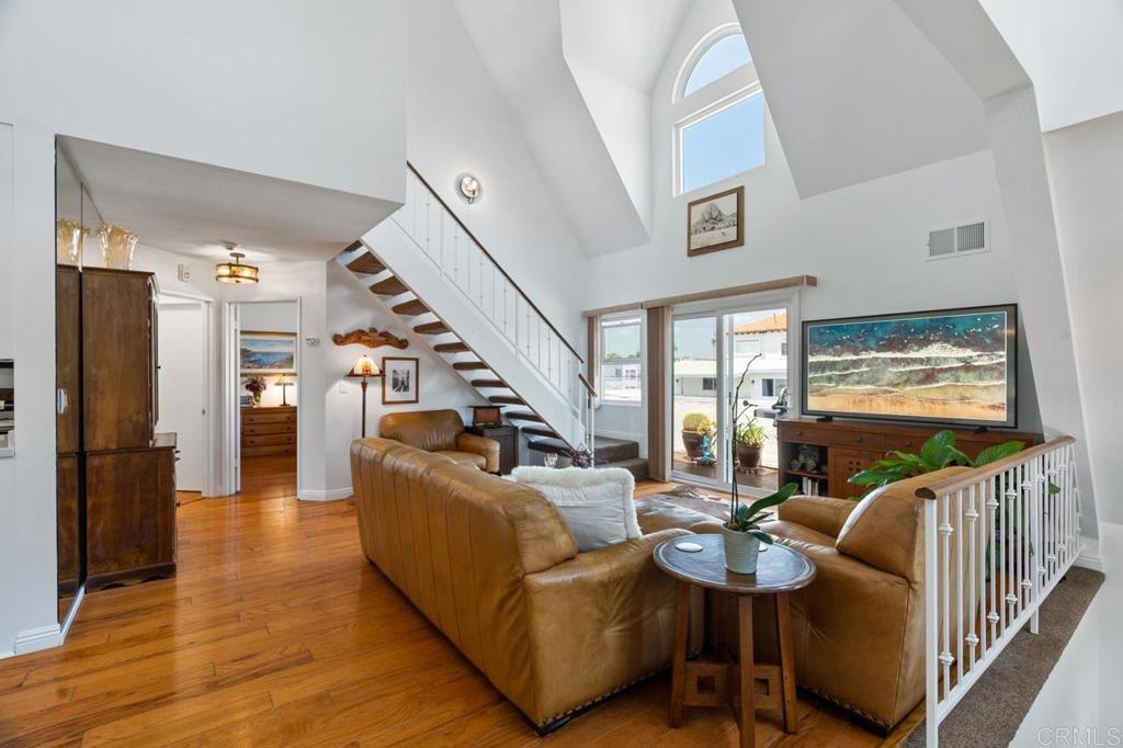 This Coronado Chalet architecture's 2br condominium lives at the apex of the complex...Views of the City across the Bay, Bridge & panorama of the Village...A cozy entrance leads to a light, bright & airy Living Room...Dine in an intimate atmosphere or expand to seat 8 or more with a mirrored wall backdrop...Updated kitchen & appliances sparkle by the sunny kitchen window... The primary bedroom is generous in size w/ walk-in closet & storage...Bathroom features double hammered textured sinks...In-unit washer/dryer combo...2nd bedroom upstairs w/ southerly views of the Village ... Amazing vaulted 24 ft ceilings...double-paned windows artistically placed to bring vignette views...MOVE-IN READY for full time residency or part time...