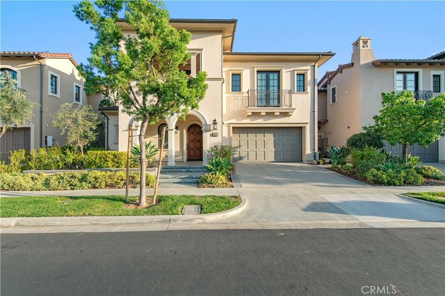 Nestled in the prestigious, guard-gated community of Orchard Hills, this stunning 4-bedroom, 4.5-bath estate offers nearly 4,800 sq ft of refined living space. Built in 2015, the home blends timeless architecture with modern elegance, featuring an expansive open-concept floor plan, soaring ceilings, and designer finishes throughout. A chef's dream kitchen boasts premium stainless steel appliances, a large center island, walk-in pantry, and custom cabinetry, flowing seamlessly into the spacious great room with a cozy fireplace--perfect for gatherings. Each bedroom is generously sized with en-suite baths, while the luxurious primary suite offers a spa-like bathroom and oversized walk-in closet. Additional highlights include a loft, formal dining room, in-unit laundry, and abundant natural light. Outside, enjoy beautifully landscaped grounds and a private patio ideal for outdoor dining. The home includes an attached 2-car garage and is part of a vibrant community with resort-style amenities such as pools, parks, and scenic trails. Located within the highly acclaimed Orchard Hills School and Beckman High School nearby.