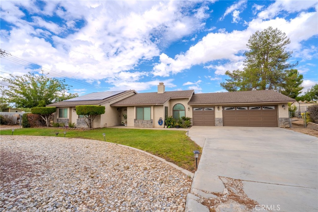 Welcome to this charming single-story home in Hesperia, set on a spacious .65 acre horse property lot. The property is fully fenced with wrought iron and block wall, surrounded by mature shade trees, lush landscaping, and features leased solar panels to help you save for years to come, all paired with a convenient 3-car garage.
Step inside and you’ll immediately notice the tall ceilings and open layout. The home offers a large living room with a double-sided fireplace, a cozy family room, a formal dining area, and a spacious kitchen with tile counters, stainless steel dishwasher and stove, recessed lighting, and multiple skylights for natural brightness. There’s also a breakfast nook with bay windows, an indoor laundry room with storage, and a guest-friendly half bath. The bedrooms are generously sized, each with ceiling fans, while the primary suite boasts direct access through a sliding glass door to the huge covered patio, perfect for enjoying desert sunsets, morning coffee, or weekend BBQs. The backyard features plenty of room to entertain all year long.
This home checks all the boxes and won’t last long in today’s market. Don’t wait, make it yours before it’s gone!