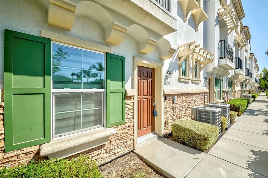 Welcome to Renato Villas, a contemporary Spanish-inspired community tucked away on a quiet residential street in the heart of Anaheim. This tri-level townhome combines modern design with low-maintenance living, offering 2 spacious en-suite bedrooms, 2.5 bathrooms, and a direct-access 2-car garage.

Step inside to discover a thoughtfully designed layout with soaring 9-ft ceilings, recessed lighting, and a cozy fireplace. The open-concept main level features a spacious great room, dining area, and a modern kitchen with a large quartz island, sleek cabinetry, stainless steel appliances, and a walk-in pantry ideal for both everyday living and entertaining.

Upstairs, both bedrooms feature walk-in closets and private en-suite bathrooms, while the primary suite is enhanced with a beautifully finished walk-in shower. A private balcony extends the living space outdoors. On the first floor, a versatile loft provides the perfect space for a home office, gym, or guest retreat.

Recently refreshed with new interior paint, the home is ready for immediate occupancy. The 2-car attached side-by-side garage is EV charger-ready, providing convenience for future electric vehicle charging system installation. As part of a relatively new community, this home also benefits from the inclusion of water in the HOA dues, offering added convenience and value.

Situated minutes from Disneyland, shopping, dining, schools, and with easy access to the 5 and 91 freeways, Renato Villas offers the perfect balance of style, comfort, and location.