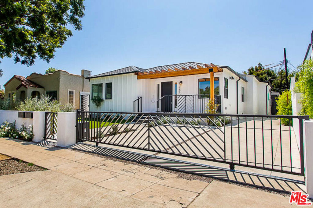 This modern 3-bedroom, 3.5-bathroom, 1,800 square foot front house will take your breath away! From the well-groomed grounds to the impeccable living quarters, every detail was designed with you in mind. Featuring Oak Wide plank floors and recessed and pendant lights throughout, the spacious living room offers a view of the manicured front yard and seamlessly opens to the chef's kitchen. The kitchen boasts a center island with a built-in sink, dishwasher, and wine refrigerator, along with a stainless-steel dual door fridge, stove, and more. Just off the kitchen, your private patio awaits perfect for entertaining or relaxing. Each of the three bedrooms includes an en-suite bath. The primary bedroom is particularly impressive, featuring a large walk-in closet with a rustic barn door and a bathroom with dual sinks. Additional stunning details include speakers throughout, a Nest thermostat, forced air heat and A/C, washer and dryer, and pre-wiring for internet. One assigned parking spot is included. Located in a premier neighborhood, this home offers seclusion and tranquility while being minutes away from Venice, Santa Monica, and Culver City.
