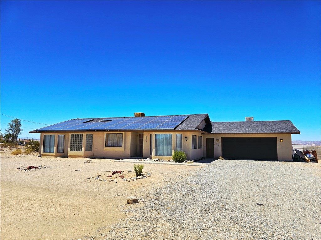 Spacious Pool Home on a 2-Acre Lot close to the Joshua Tree National Park.
This solid and spacious pool home sits on a generous 2-acre lot and offers 3 large bedrooms and 2.5 bathrooms. Move-in ready with great bones, it presents an excellent opportunity for you to add your own personal touch with light cosmetic updates.
The expansive kitchen is a cook’s dream—featuring a large island, breakfast bar, and ample counter and cabinet space for all your culinary needs. The layout includes two well-sized guest bedrooms and a large main suite with a roomy attached bathroom. In the winter months, cuddle up with your favorite book by a cozy woodburing fireplace.
Step outside to your private backyard oasis, complete with a stunning saltwater pool and spa, a covered patio perfect for entertaining, and a high block wall that offers both privacy and security.
Don't miss this rare opportunity to own a home with space, privacy, and endless potential.