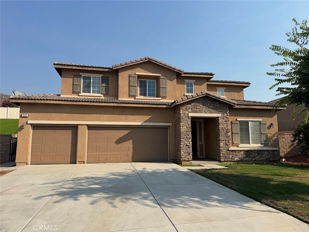 Welcome to 12221 Dewar Drive, a beautifully maintained 5-bedroom, 3-bathroom home (Assessor data shows 4 bedrooms) in the desirable La Sierra neighborhood of Riverside. Built in 2015 and offering over 3,100 sqft of living space on a spacious 9,583 sqft lot, this two-story residence features an open-concept layout filled with natural light, new wood look floors, and a cozy fireplace. The large kitchen is equipped with modern appliances, granite countertops, a central island, and abundant cabinetry—ideal for family gatherings and entertaining. One bedroom and full bath are conveniently located on the main level, while the upstairs includes a luxurious primary suite and generously sized secondary bedrooms. Located minutes from schools, shopping, parks, and freeways, this home combines space, functionality, and everyday convenience in a quiet, well-established neighborhood.