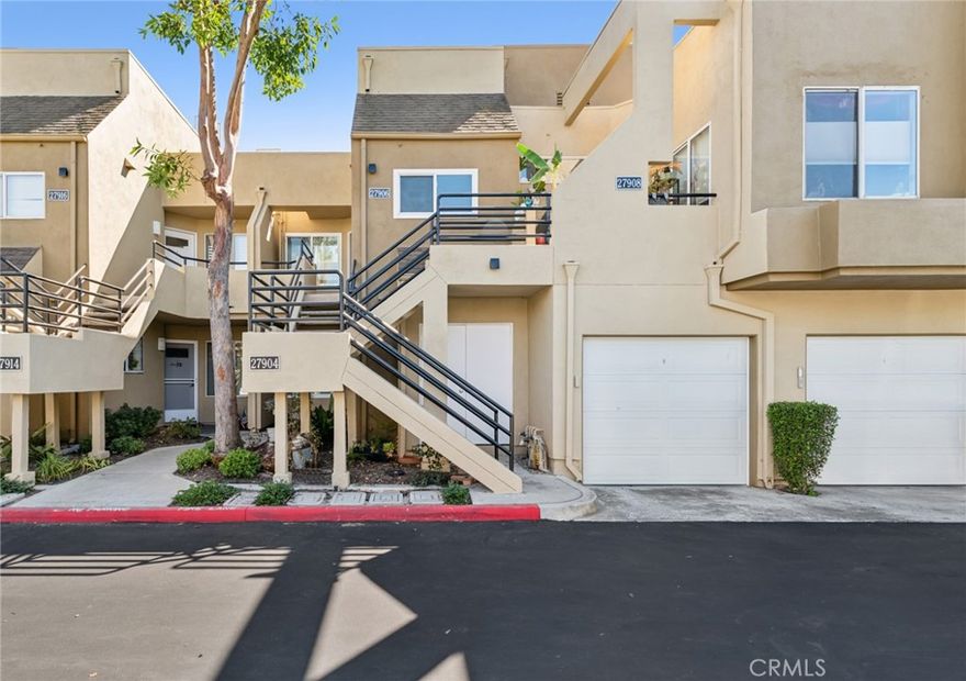Nestled in the sought-after community of Rainbow Ridge, this updated 2-bedroom, 2-bathroom residence combines comfort, style, and convenience. A dramatic entry with soaring ceilings and expansive windows fills the interiors with natural light, enhancing the sense of space. The open-concept living area features a tiled fireplace and flows seamlessly to a large private balcony, perfect for both relaxing and entertaining.

The main-floor primary suite offers a spacious walk-in closet and a well-appointed full bath. Upstairs, the secondary bedroom provides privacy with its own en-suite bath and closet. The kitchen is designed with efficiency and function, opening to the dining and living areas for a connected lifestyle.

Recent upgrades add to the home’s appeal, including luxury plank flooring, remodeled bathrooms with modern finishes, motorized window shades, a new water heater, and a complete plumbing re-pipe in 2025. Thoughtful details throughout reflect quality and attention to design.

Residents of Rainbow Ridge enjoy tree-lined surroundings and access to Lake Mission Viejo membership, which includes lakeside activities, picnic areas, summer concerts, and movie nights. The community is also ideally located near shopping, dining, entertainment, and major freeways, making it a perfect blend of comfort and convenience.