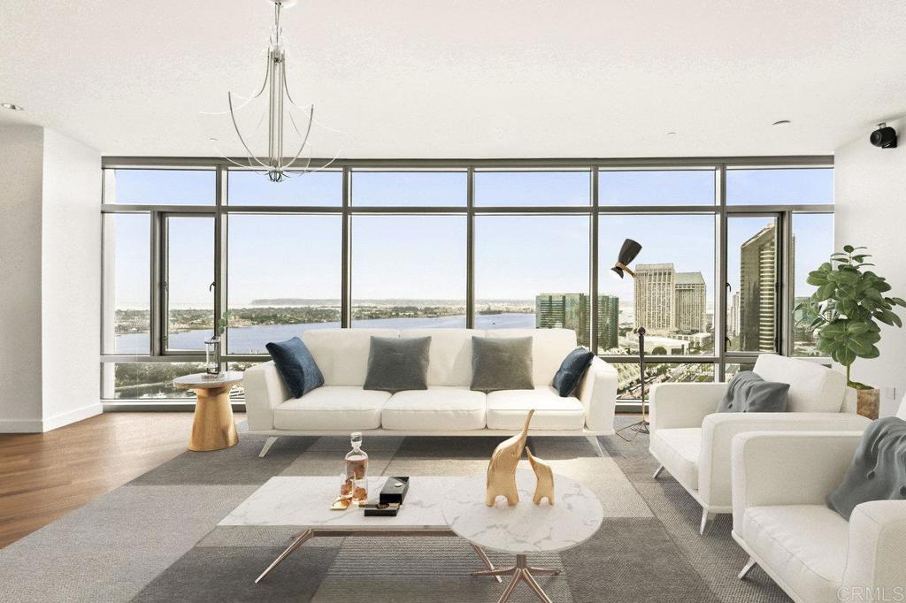 Completely Remodeled Luxury Residence at The Metropolitan Welcome to Unit #2504 at The Metropolitan — one of San Diego’s most exclusive and private high-rises, perched atop the Omni Hotel in the heart of downtown. This completely remodeled 3-bedroom, 3.5-bath offers 2,466sf of refined luxury with unparalleled panoramic views of San Diego Bay, the Pacific Ocean, Coronado, Point Loma, the city skyline, and Petco Park. The spacious layout features brand new carpet, fresh paint, and a gourmet Chef's kitchen with upgraded stainless steel appliances, granite counters, and sleek white cabinetry. Walls of glass throughout the home flood the space with natural light and showcase breathtaking views from every room. As a resident of The Metropolitan, you’ll enjoy exclusive access to the Omni Hotel’s luxury amenities including pool, gym, room service, housekeeping, and concierge, offering true hotel-style living. The building also features the private skybridge to Petco Park for direct VIP access to games and events. Additional elite amenities include Club 22, a Metropolitan residents-only rooftop retreat with a pool, jacuzzi, BBQ area, lounge, and view deck overlooking Petco Park — the ultimate in luxury and privacy. This rare offering also includes two reserved parking spaces in a secure underground garage and a large, private storage unit located just outside the front door for maximum convenience. With only 36 total residences — most of which are second or third homes — The Metropolitan offers an incredibly private and quiet environment in the center of downtown San Diego. The Metropolitan is a world-class residence with unmatched views, full-service amenities, and a lifestyle that’s second to none. These sought after "4 stack" units rarely come on the market.