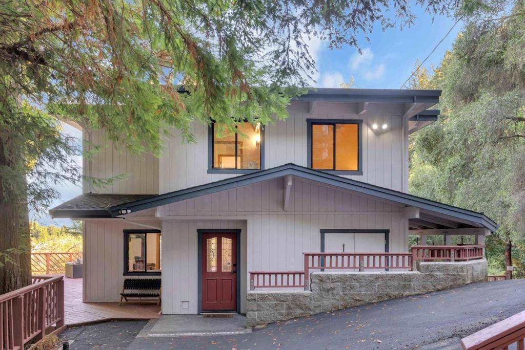 A haven perched amongst Felton's picturesque redwoods, this 2bed/1.5bath gem offers tranquil seclusion, minutes to main roads. Set in a spectacular location that receives a mix of sun & shade, this beautifully updated home boasts expansive wrap-around decking that's perfect for entertaining or relaxing. The views are spectacular! The kitchen is well-appointed with modern amenities, including quartz countertops, a gas oven range, dishwasher, microwave, and refrigerator. The family room is seamlessly integrated with the dining area, creating an inviting space for gatherings, and features a fireplace that adds warmth and charm. Upstairs you'll find both bedrooms, a full bathroom with shower over tub, washer/dryer, and a private jetted tub room with views! Step out onto the second level deck to truly enjoy the expansive views, and peace and tranquility of the majestic surroundings. Upgrades include: Fresh interior paint, refinished hardwood floors, brand new carpet, quartz countertops, painted cabinets, repaved driveway, Tesla wall battery, and much more. Nestled on a rare, huge 2.269 acre lot with usable land. A coveted Lompico location close to hiking trails, Felton restaurants, 25 minutes to Santa Cruz and 40 minutes to Los Gatos. San Lorenzo Valley Unified School District.