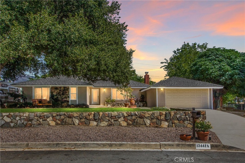 Discover Birch Street living, just steps away from Yucaipa’s historic downtown. This upgraded home blends modern conveniences with classic charm. A grand oak tree with a swing welcomes you home, while inside you’ll find a remodeled kitchen with quartz counters and new cabinets, a warm fireplace in the living room, and beautifully updated bathrooms. The oversized back porch features a laundry area and space for entertaining. Plus, the detached outbuilding offers endless possibilities—perfect for a home office, creative studio, model train enthusiast, homeschooling, or potential ADU. The choice is yours. Don’t miss the opportunity to own this versatile and property.
