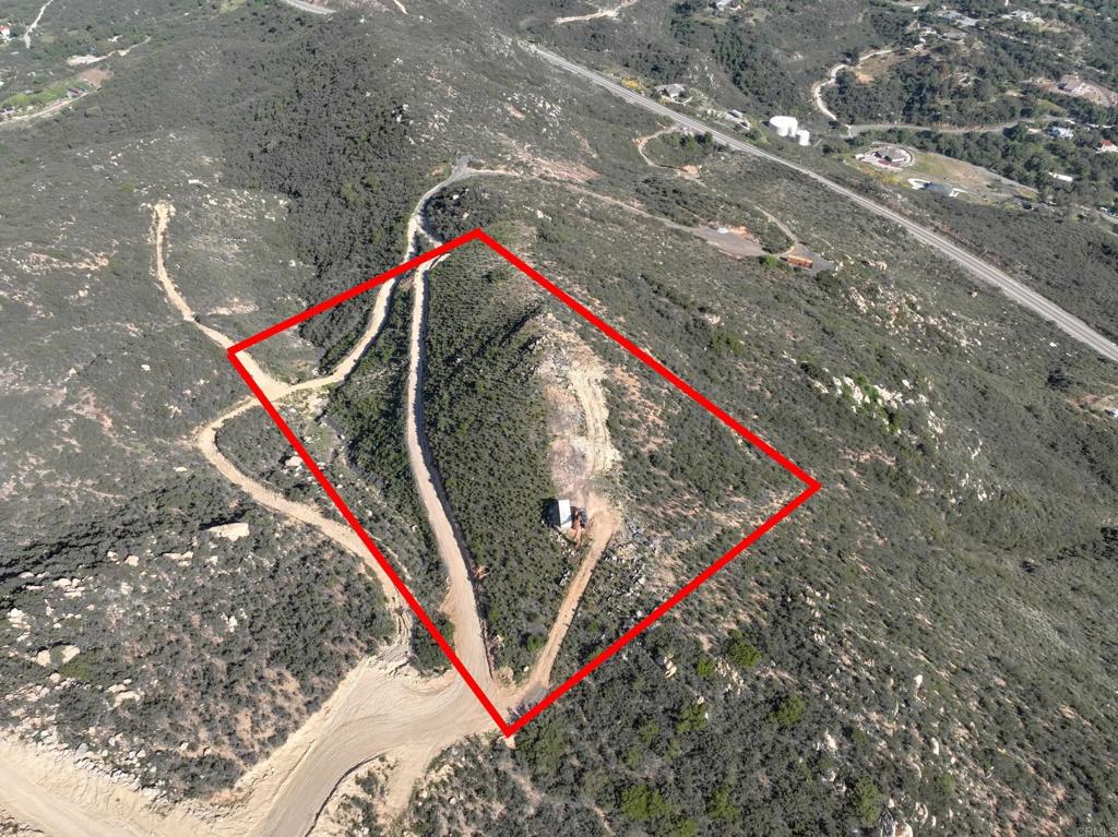 Build your dream home at the top of this 5 acre lot with beautiful panoramic views over City of Jamul. Bushes and shrubs cleaned out. Grading done for well placement. Blueprint for 5000 sq ft house with pool and jacuzzi available. Property fence posts installed. Percolation test done.