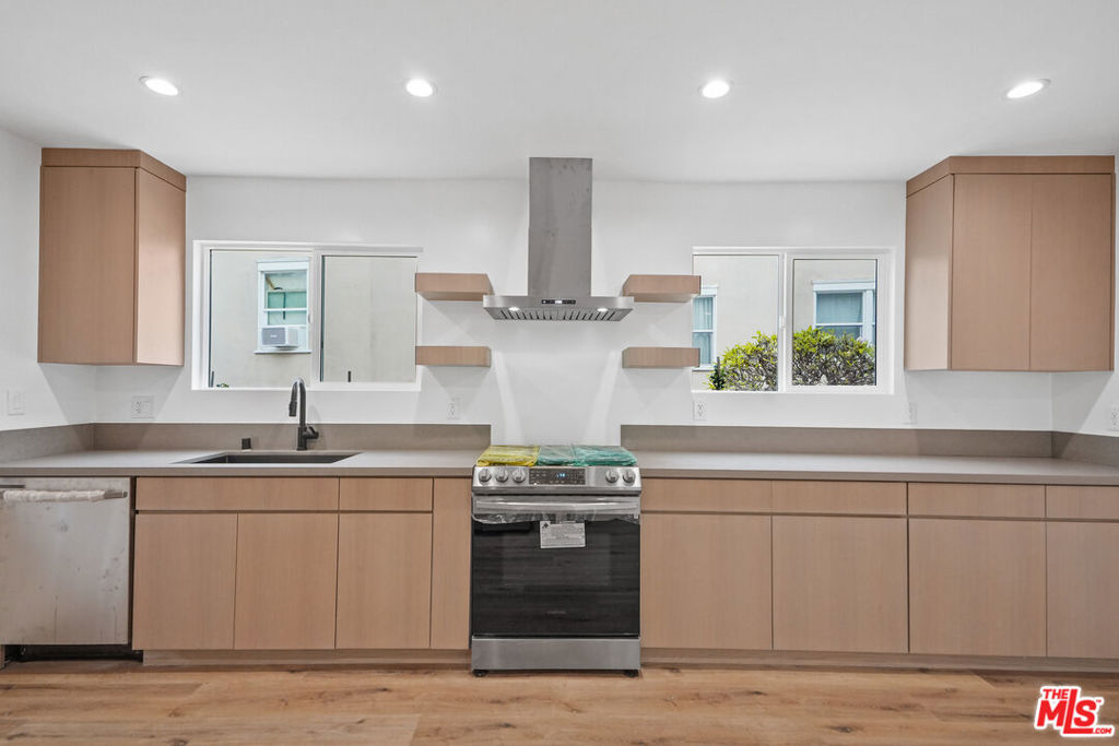 Stunningly remodeled 2-bedroom, 2-bath unit in prime Los Feliz location. This spacious 1,283 sq ft residence features brand-new appliances, including an in-unit washer and dryer, custom-built cabinetry, recess lighting, laminate floors and dual-pane windows throughout. The open layout offers both comfort and style, ideal for modern living and entertaining guests. Luxurious kitchen with stylish cabinets, quartz countertops and stainless steel appliances. Central Air/Heat with Nest thermostat. Primary bedroom suite with 2 closets and a beautiful spa-like bathroom with a luxurious soaking tub, walk-in shower and a dual vanity. Off-street garage parking is included. Located just minutes from the best dining, shopping, and entertainment Los Feliz has to offer. A rare opportunity to lease a beautifully remodeled home in one of LA's most desirable neighborhoods. Schedule your showing asap!
