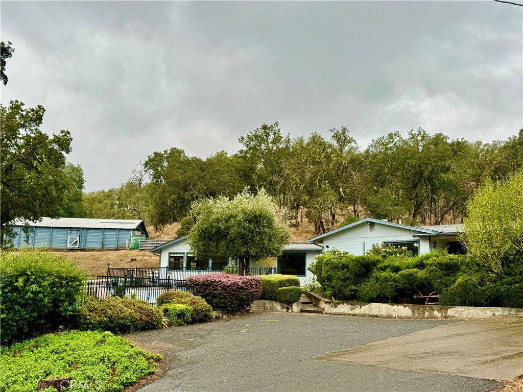 PRIME LOCATION! Nestled in the heart of serene Potter Valley, you will surely witness the iconic beauty and fall in love with this unique, oak studded 7.5 acre property featuring a +\- 2,066 sq ft. country home surrounded by hills, vineyards and offering ample SPACE, privacy, peaceful setting and HORSE facilities. Inside you will find a large living room area, country kitchen with tile counters and laminate flooring, 2 bed/ 2 bath and full of country charm. A surprising BONUS is an incredible built in FULL BAR for ultimate entertaining experiences. This bar and separate large entertaining room can be accessed by its own entrance or inside the home and may also be used as an office, extra bedroom or family room area. Outside, find a detached garage and workshop area, covered carport and barn. Enjoy your coffee under the olive tree and roses overlooking the hills & vineyards from your private front patio. This home has something for everyone with two fenced gardens, an above ground pool with extensive decking for a great outdoor entertaining spacel and ideally situated in a peaceful country setting but easy access to Ukiah, Willits and surrounding areas. BRING the horses! You will find fenced horse arena and barn on site. Potter Valley features rolling hills and lush forests. The Russian River flows through the area, providing an ultimate outdoor adventure with so many possibilities for kayaking, fishing, scenic picnics and snow covered hills from the Mendocino Forest. The quaint downtown area features local culture, small shops and friendly faces. Home is being sold AS IS. Buyer is to confirm all lot lines & utilities. You don't want to miss seeing this distincitve opportunity.