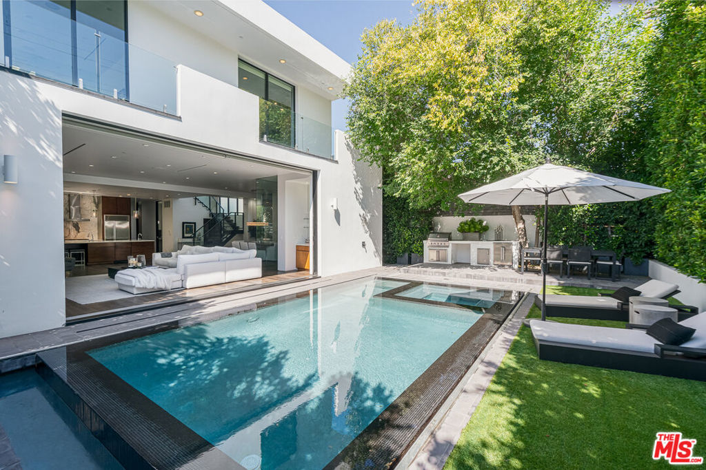 Don't miss this stunning 4-bedroom, 6-bathroom residence offering over 4,000 square feet of thoughtfully designed living space. Featuring soaring ceilings, an open floor plan, automatic shades, and a fully equipped outdoor kitchen, this private retreat seamlessly blends luxury, comfort, and modern convenience. Perfectly positioned between West Hollywood and Beverly Hills, you'll enjoy easy access to world-class shopping, dining, and entertainmentall just a short walk away.