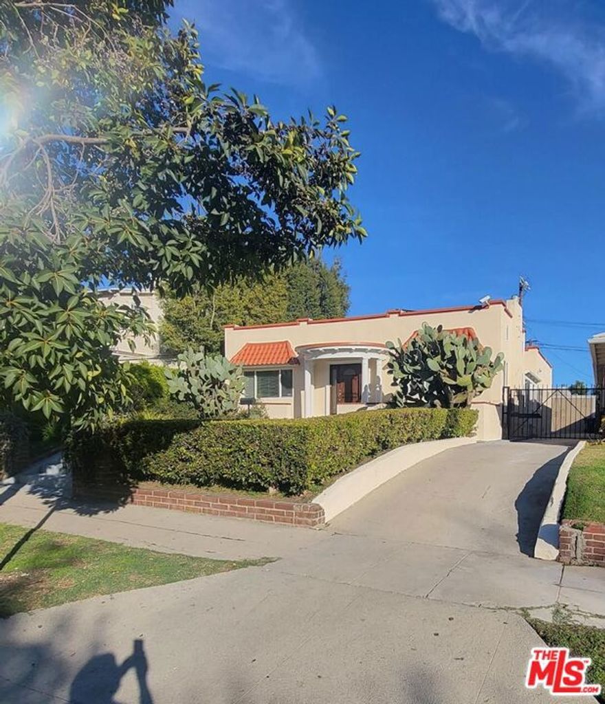 This 4 bedroom 2.5 bathroom house is located in the County Club Park. Ready to move in...Cozy, bright, and airy...Freshly re-painted interior...Central AC/Heating. A striking entrance leads to a wide walkway. It opens to a light-filled, front sitting room. The formal living, room and the ample, open chef's kitchen feature marble countertops, top-of-the-line appliances, designer light fixtures, ample storage space, and custom cabinetry. This light-filled home is designed and upgraded to perfection, a must-see . 2 Blocks from Koreatown Galleria close to WESTERN and OLYMPIC Gated driveway for extra privacy and security.