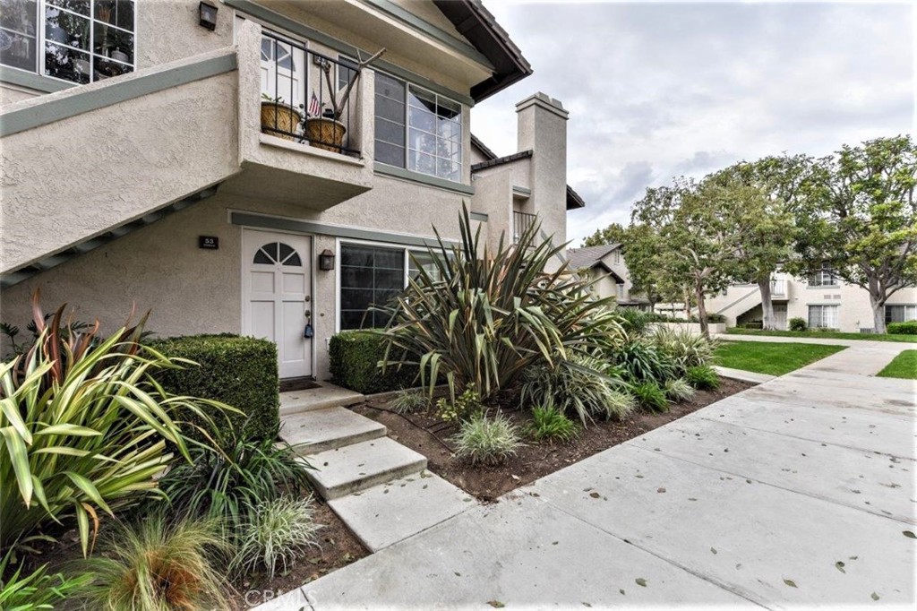 Luxurious 2-Bedroom Downstairs End Unit with Premium Custom Upgrades – Walking Distance to UCI and nationally ranked University High school. Elegant kitchen upgraded with granite countertops, Newport Brass fixtures, Osmosis water filter system, boiling hot water dispenser, Bosch range hood, hidden paneled Bosch dishwasher and trash compactor, glass gas 4 burner cooktop, building oven with microwave functionality, built-in refrigerator with freezer, Euro-style white high gloss cabinets with soft close hardware and solid brass handles. Custom designed Bathroom covered with floor to ceiling & wall to wall in 24x24 porcelain tile, quartz countertops, white cabinets, Kohler modern square sinks, ceiling high mirror, and Newport Brass mirror fixtures. Walk-in shower separated by floating pieces of glass. The shower fixture was imported from Italy and it is recessed into the tile, with the option to use an overhead waterfall or the shower hose. Spacious bedrooms with built-in closet and large windows for natural light. Hallway has additional linen cabinets. Built in surround sound speakers for the best entertainment when watching TV. Spacious Living Room with fireplace. Inside laundry. Newer energy efficient AC. Double paneled windows with Hunter Douglas shades. 24x24 tile flooring throughout, recessed lights with state of the art non-touch switches, retractable wall plugs. Private balcony off the dining area with spacious garden and delightful flowers. Quiet inside-tract location among beautiful trees with peaceful greenbelt view. Association amenities include pool, basketball court, tennis court, tot lot, and plenty of greenbelts and walking trails. Low HOA, low Tax and No Mello Roos.