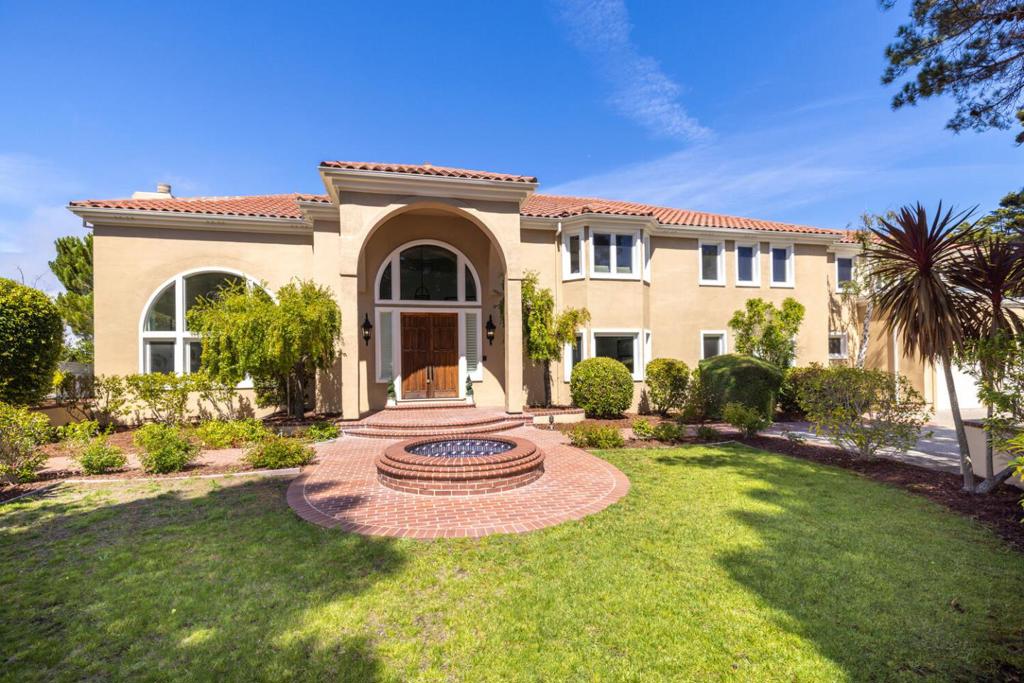 Experience the perfect blend of luxury, elegance & California living in this breathtaking Mediterranean estate. This residence offers unparalleled privacy & sweeping views of the San Francisco Bay & surrounding mountains. A long, gated driveway welcomes you setting the stage for the home's elegant interior. Step inside to a dramatic, light-filled foyer featuring a graceful winding staircase that leads into an expansive living room framed by floor-to-ceiling windows showcasing the spectacular views.The gourmet chef's kitchen is comes complete with a large center island, elegant stone countertops, & top-of-the-line Viking stainless steel appliances. A richly wood-paneled library/office & spacious formal living & dining areas add sophistication, while new double-pane windows enhance comfort & energy efficiency throughout the home.Upstairs a primary suite awaits, featuring a spa-inspired bath with a jetted soaking tub, alongside generously sized bedrooms offering comfort & privacy. The impeccably landscaped grounds create a true oasis, featuring a resort-style pool & spa, & private tennis court. Perfect for both relaxation & entertaining, this property offers an unmatched lifestyle in one of California's most coveted settings.