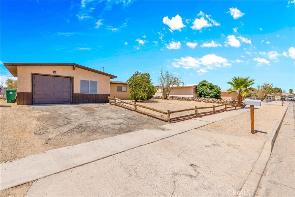 Charming Home in the Heart of 29 Palms!
This inviting 3-bedroom, 2-bathroom home spans 1,328 sq ft and offers the perfect blend of comfort and convenience, ideal for first-time buyers or
Investors. Step inside to discover a bright, open-concept living space with ample natural light, perfect for relaxing or entertaining.
The kitchen with appliance's flows seamlessly into the dining area, while the versatile bonus room offers endless possibilities—think home office, playroom, or cozy den. Retreat to the spacious primary suite, complete with an en suite bath for added privacy. Two additional bedrooms provide plenty of space for family, guests, or rental potential.
Outside, enjoy a fenced backyard with a covered patio, perfect for savoring warm desert evenings or hosting barbecues. The attached one-car garage offers convenience and storage, while the low-maintenance lot keeps upkeep simple. Nestled next to 29 Palms High School and just minutes from Joshua Tree National Park, local schools, and a vibrant shopping center, this home combines serene desert living with urban accessibility.
Don't miss this turnkey gem—whether you're starting your homeownership journey or seeking an investment property, this home delivers unmatched value in a prime location. Schedule your tour today!
Buyer to independently verify all MLS information, including, but not limited to, permits, property use, bedroom/bathroom counts, square footage, school districts, and enrollment availability. Buyer is strongly encouraged to conduct their own investigations and inspections to confirm the accuracy of all information provided.