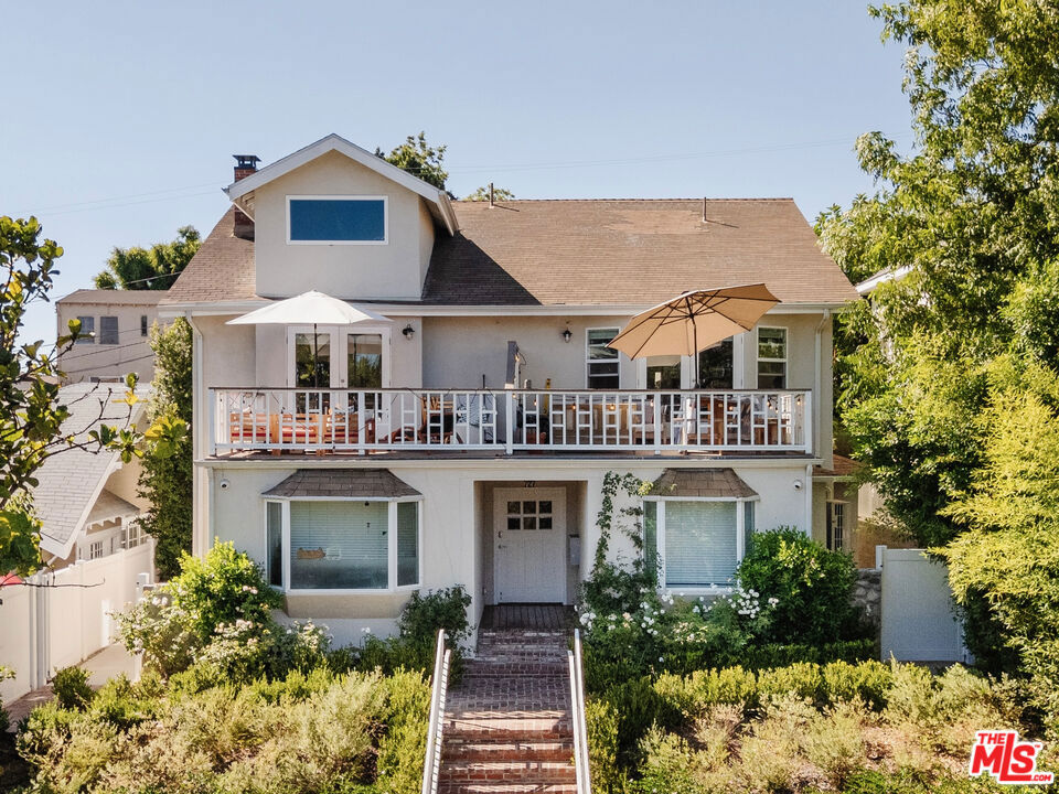 Perched above a tree-lined street, 727 N La Fayette Park Place welcomes you with a beautiful brick staircase flanked by lush greenery and rose bushes leading to the front entrance. This completely transformed 1908 fourplex combines historic character with modern luxury and offers exceptional investment potential in one of Los Angeles' most coveted neighborhoods of Silver Lake. This two-story gem features one generous 3-bedroom, 3-bath unit and three spacious 2-bedroom, 2-bathroom units. Each unit features beautiful floors, central air and heat, and abundant natural light. Every unit boasts a bright kitchen with white cabinetry and countertops, and new stainless steel appliances. The bathrooms stand out with details like wainscoting, daisy patterned tiled floors, and glass-enclosed showers. Select units include double vanity sinks in the primary bedroom, and every unit offers a walk-in closet and comes equipped with an in-unit, side-by-side washer and dryer, a rarity in Los Angeles! Upper units feature French doors that lead to spacious decks, perfect for quiet mornings and weekend gatherings with friends, while ground-floor units showcase bay windows that overlook the front garden. The building offers secure gated parking. The location is unbeatable, just one block from iconic Sunset Boulevard and within walking distance to the vibrant Sunset Junction area. Silver Lake's unique blend of bohemian culture, architectural diversity, and urban sophistication creates an unparalleled living experience that attracts creative professionals, young families, and discerning renters who appreciate both character and convenience. This fourplex offers strong income-generating potential with its top-to-bottom renovations, distinctive unit layouts, and prime Silver Lake location with easy access to Silver Lake's best dining, cafs, boutique shops, and cultural attractions.