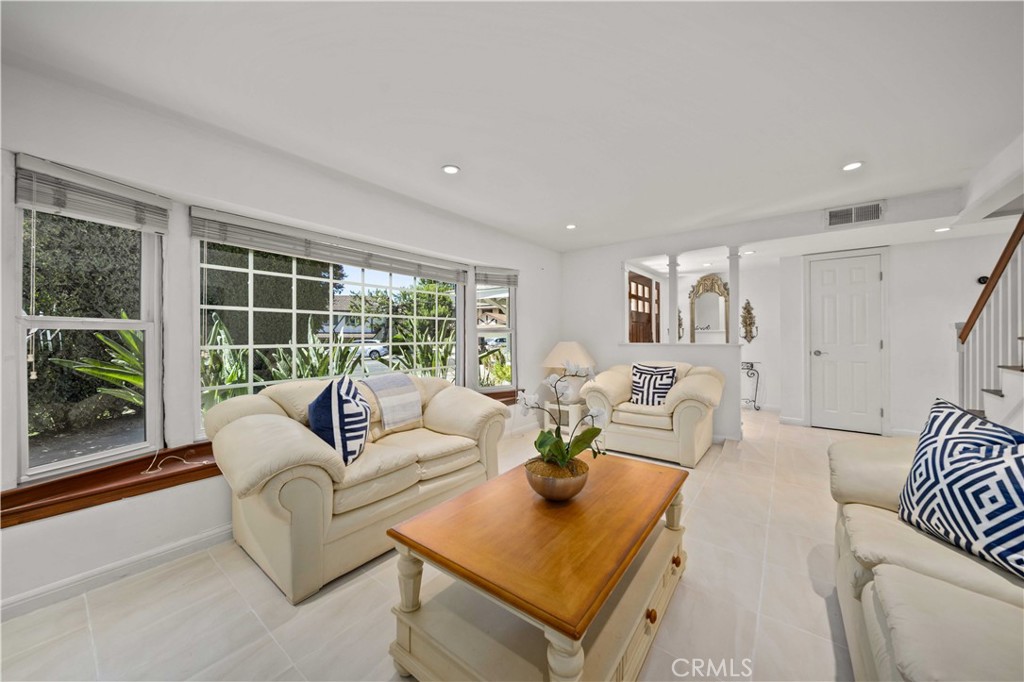 A RARE Find with Space, Privacy, and Endless Possibilities. One-of-a-Kind 5 bedroom 3100 sf two story gem privately hidden on a cul-de-sac on more than 1/3 of an acre with a grassy flat, fenced yard just a short drive north of the greater Los Angeles area. This treasure of a neighborhood has tremendous value - where you can get a large house and a huge lot for a fraction of the cost that it would be just 10 miles to the south - with convenient access to the 5 and 14 freeways, Old Town Newhall, schools, area parks, shopping, Magic Mountain, golf courses, etc. The backyard is truly the centerpiece of this property — private, peaceful, and backed by open hillside with no neighbors looking in. There’s room to run and play - kick a soccer ball or throw a football - shaded spots to relax, and plenty of space for entertaining. With 16 varieties of fruit trees, a vegetable garden, a patio, and even a swing under a mature shade tree, it’s a yard that invites everyday comfort and enjoyment as well as large gatherings. Inside, the layout offers flexibility for multi-generational living or work-from-home needs. Accessibility has been thoughtfully considered, with the downstairs fully wheelchair-friendly and features an oversized Primary En-suite with its own living area, full bath w/walk-in closet, and private side yard access (ideal for in-laws, guests, or a potential ADU conversion). Upstairs, you’ll find 4 more bedrooms, including a second Primary En-suite tucked away on the backside of the house with yard & hillside views and a full bath with jetted tub and granite counters. Notable upgrades and features of the home include: Dutch door entry into the kitchen, farmhouse sink, granite counters & stainless appliances, oversized family room, fireplace, wood & tile floors, recessed lighting & ceiling fans throughout, white vanity cabinets w/granite in all baths, and mirrored wardrobe doors. The home offers a 3-Car Garage, Central A/C, Whole-house Fan, RV access for a small trailer or boat (can be expanded with a slight modification to the roofline), and two outbuildings for storing crafts, gardening tools, etc. This is one of those properties that has endless possibilities (Recently there was a full wedding with dance floor held in this back yard), including ADU potential without taking up much of the yard.