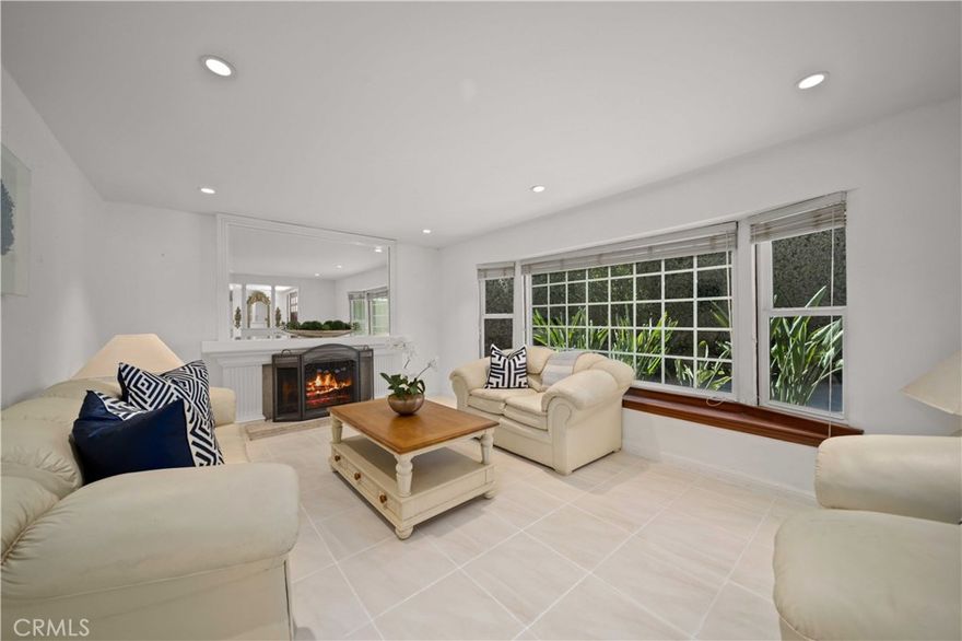 A RARE Find with Space, Privacy, and Endless Possibilities. One-of-a-Kind 5 bedroom 3100 sf two story gem privately hidden on a cul-de-sac on more than 1/3 of an acre with a grassy flat, fenced yard just a short drive north of the greater Los Angeles area. This treasure of a neighborhood has tremendous value - where you can get a large house and a huge lot for a fraction of the cost that it would be just 10 miles to the south - with convenient access to the 5 and 14 freeways, Old Town Newhall, schools, area parks, shopping, Magic Mountain, golf courses, etc. The backyard is truly the centerpiece of this property — private, peaceful, and backed by open hillside with no neighbors looking in.  There’s room to run and play - kick a soccer ball or throw a football - shaded spots to relax, and plenty of space for entertaining. With 16 varieties of fruit trees, a vegetable garden, a patio, and even a swing under a mature shade tree, it’s a yard that invites everyday comfort and enjoyment as well as large gatherings. Inside, the layout offers flexibility for multi-generational living or work-from-home needs. Accessibility has been thoughtfully considered, with the downstairs fully wheelchair-friendly and features an oversized Primary En-suite with its own living area, full bath w/walk-in closet, and private side yard access (ideal for in-laws, guests, or a potential ADU conversion). Upstairs, you’ll find 4 more bedrooms, including a second Primary En-suite tucked away on the backside of the house with yard & hillside views and a full bath with jetted tub and granite counters.  Notable upgrades and features of the home include: Dutch door entry into the kitchen, farmhouse sink, granite counters & stainless appliances, oversized family room, fireplace, wood & tile floors, recessed lighting & ceiling fans throughout, white vanity cabinets w/granite in all baths, and mirrored wardrobe doors. The home offers a 3-Car Garage, Central A/C, Whole-house Fan, RV access for a small trailer or boat (can be expanded with a slight modification to the roofline), and a outbuilding for storing crafts, gardening tools, etc. This is one of those properties that has endless possibilities (Recently there was a full wedding with dance floor held in this back yard), including ADU potential without taking up much of the yard.