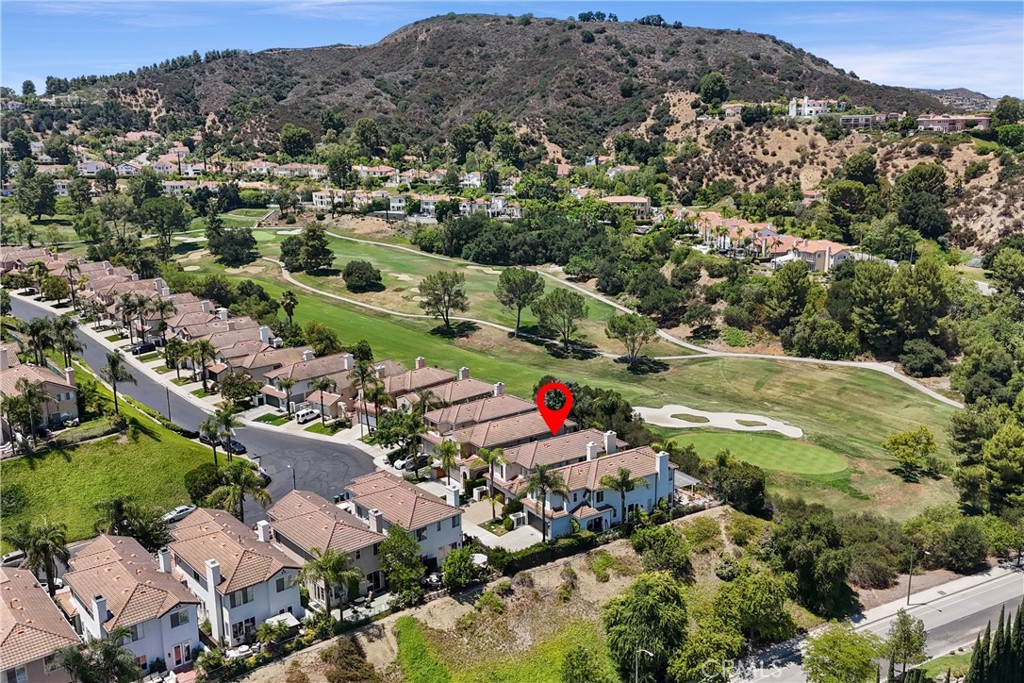 Golf Course View Palatino home inside the gated Calabasas Park Estates
This beautifully updated home offers scenic, unobstructed views of the Calabasas Country Club Golf Course as well as a panoramic hillside views of Calabasas. This home welcomes you with a charming arched entry and a gated courtyard leading you to the tall iron/glass front door. Once inside you will be greeted to an open-concept layout with approximately 10-foot high ceilings and wide-plank hardwood flooring throughout. As you enter the home you will find the living room area as well as a sitting area and a powder room. The spacious kitchen has been tastefully upgraded with granite countertops, custom cabinetry, stainless steel appliances, and a large center island—ideal for everyday living and entertaining. The kitchen connects seamlessly to the adjacent living space which is currently being used as a dining area with a modern chandelier and large hearth and mantle surrounding the fireplace. Three sets of glass/wood doors lead to a tranquil backyard with easy to maintain landscape including artificial turf, and panoramic golf course and hillside views. Upstairs, all bedrooms are located on one level. The generous primary suite features a cozy sitting area with an electric wall fireplace, exceptional golf course views, a remodeled en-suite bathroom, with a custom-built walk-in closet offering excellent storage and organization. What had been the fourth bedroom was remodeled to an open office/loft space adding to the primary suite but can be restored/enclosed to its original design. A dedicated upstairs laundry room adds everyday convenience. Recent improvements include a brand new 5-ton AC PRO AC/Furnace system installed in JUNE 2025, complete with a 10-year warranty for added peace of mind. This HOA provides a guard gated entrance plus association/community pool/spa. Conveniently situated near shopping, dining, and local amenities including The Commons at Calabasas, Calabasas Lake, and easy freeway access, this property presents a rare opportunity to enjoy a comfortable and stylish home that is "Simply Classic" Palatino Calabasas.