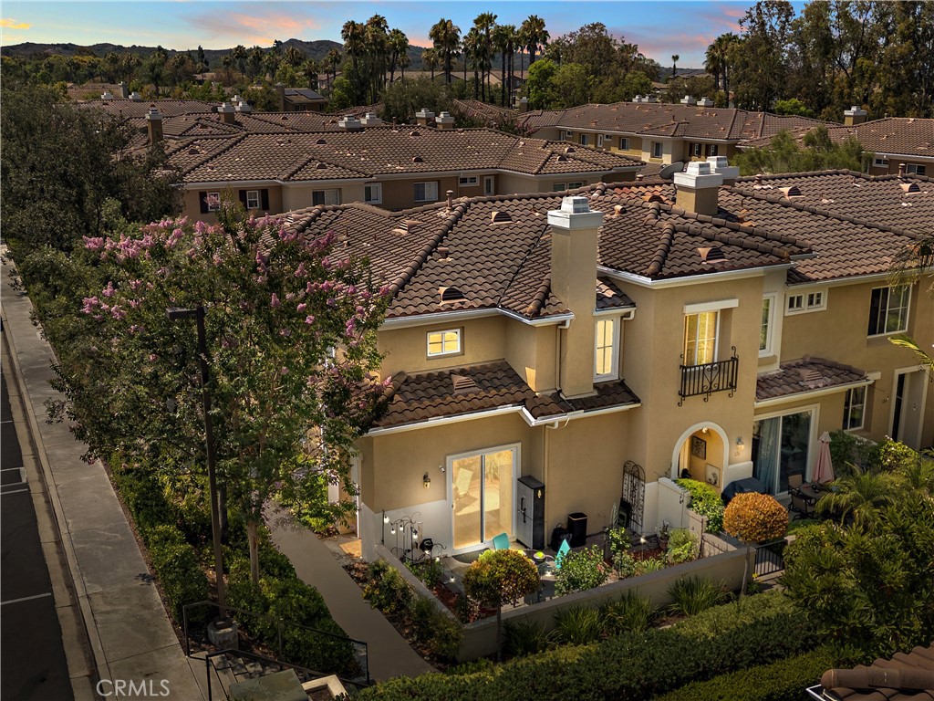 Welcome to 128 Via Vicini in sought-after Rancho Santa Margarita, California's safest city. This popular end-unit townhome is perfectly situated near a cul-de-sac for a private, interior location. Boasting 4 bedrooms and 2.5 baths in over 1650 sq ft, you will immediately fall in love with the open concept layout with high ceilings and lots of natural light. The living room features a fireplace and media niche and is adjacent to the large dining room which has access to the patio. The kitchen offers plenty of counter and cabinet space and there's a large pantry/storage room. In addition, there's a laundry room and guest bathroom.
Upstairs, there are 4 bedrooms and two full bathrooms. The spacious primary bedroom has a walk-in closet and a dual sink bathroom. The secondary bedrooms are ample while the 4th room with an extra storage closet is larger and can be used as a bedroom, office or multi-purpose room. The secondary bathroom is perfectly situated between the extra bedrooms and boasts a new vanity and lighting.
The freshly painted interior, new window blinds, newer air conditioning system and water heater provide a clean, well-maintained aesthetic along with modern and energy efficient features.
You will appreciate the serenity of your private and spacious patio which offers a tranquil and peaceful environment, perfect for relaxation.
Enjoy the close proximity to shopping, dining and Samlarc amenities including parks, courts and the beach club.
The low monthly HOA helps with affordability!