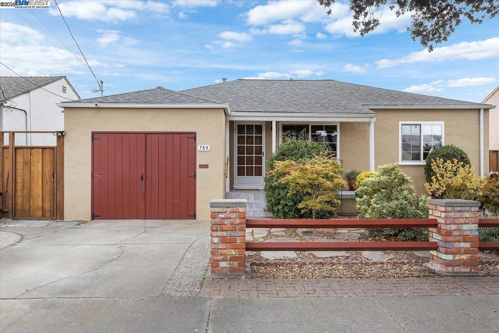 Discover this single-level move-in ready San Leandro bungalow. Sited on a large level lot, and offering off-street parking and an attached garage with washer & dryer, this meticulously cared for and pristine condition two-bedroom home is ready for its next owners. With refinished hardwood floors and newly installed baseboards throughout the living room, dining area, and both bedrooms, upgraded vinyl windows, central heating and air conditioning, and updated kitchen, this property is a real head-turner. Interior has some rooms with fresh interior paint. Exterior painted recently as well. The landscaped front yard highlighted with Japanese maples and quaint front porch pair with a spacious, fenced, and level back yard with additional storage/workshop shed, fruiting Fuji apple tree, 2 patios, and side areas perfect for a dog run. Great yard to entertain in! Functioning well to water yards thus saving on the water bill. This gem of a home has been meticulously maintained by the same owner for 33 years and is not to be missed! Bonus - one year home warranty included with the right offer!