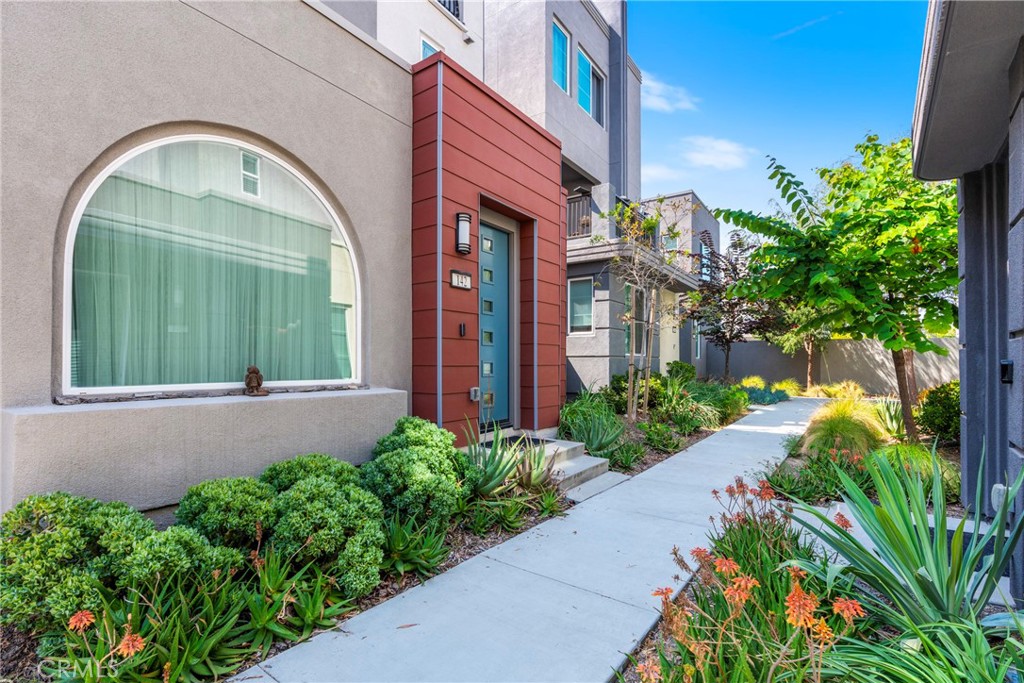 This beautiful completely detached single-family house is located in Novel Park, part of the Great Park community in Irvine. As you walk in, you are greeted with a South-facing arched window that lets in plenty of natural light throughout the day. Downstairs features a spacious, inviting open concept Great Room and Dining area. The Kitchen features a large countertop with modern appliances. Completing the downstairs area is a Half Bath and access to a patio. On the second floor it showcases a Primary Bedroom with an en-suite bathroom, two separate bedrooms and a bathroom. A bonus third floor has an oversized Loft, a Balcony, and another Half Bath creating a perfect space for an office or additional bedroom! As part of the highly sought after Great Park Neighborhoods, residents have plenty of access to amazing amenities including multiple pools, parks, trails, and so much more! refrigerator, washer & dyer included.