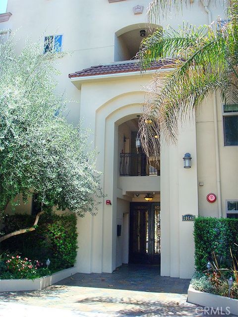 Photo of 10640 WOODBRIDGE Street #PH2, Toluca Lake, CA 91602 (MLS # SB26059961)